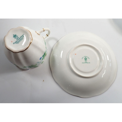 45 - A Royal Crown Derby tea service decorated flowering vines comprising five cups and six saucers, six ... 