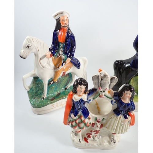 47 - A group of four Victorian Staffordshire equestrian figures and two watch stands, tallest 30cm