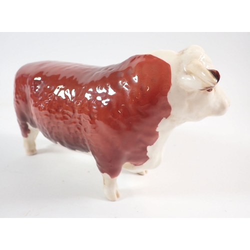 12 - A Beswick Hereford Bull 'Champion of Champions' 29cm long, tail repaired