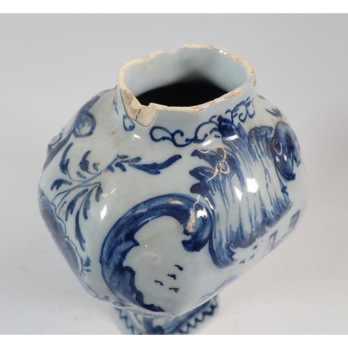 127 - A Delft vase and cover painted town scenes with bird finial, 25cm - some damage