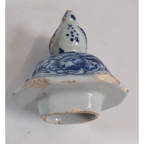 127 - A Delft vase and cover painted town scenes with bird finial, 25cm - some damage