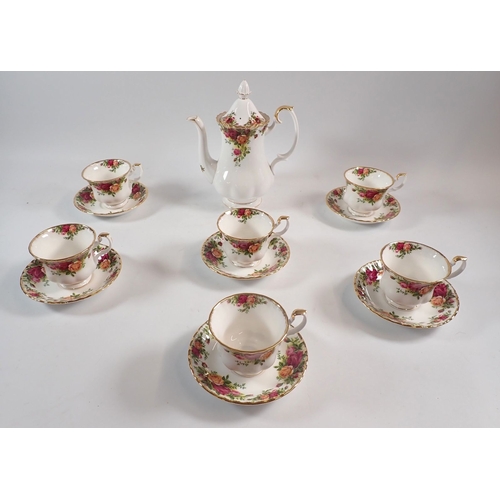 129 - A Royal Albert Country roses coffee set, comprising of six cups and saucers and a coffee pot
