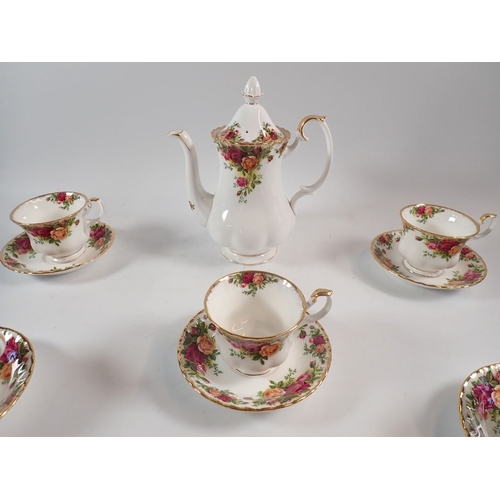 129 - A Royal Albert Country roses coffee set, comprising of six cups and saucers and a coffee pot