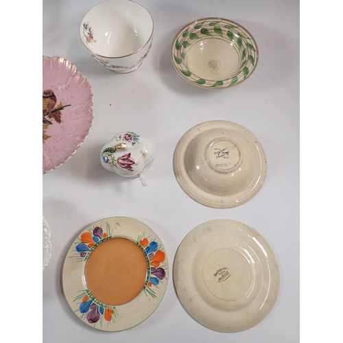 130 - A group of decorative china including two Clarice Cliff bowls and plates, Royal Worcester cup and sa... 