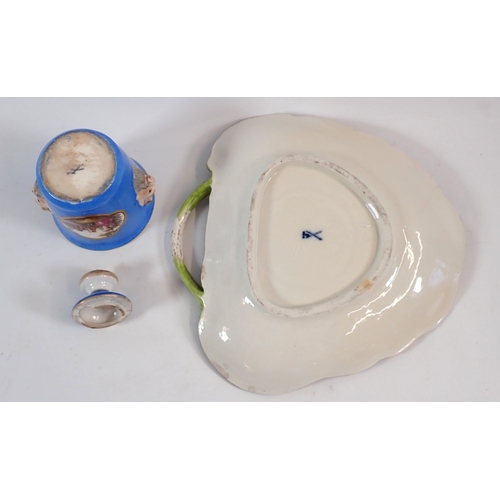 133 - A Meissen style inkwell on stand painted landscape and figure panels on a blue ground, crossed sword... 