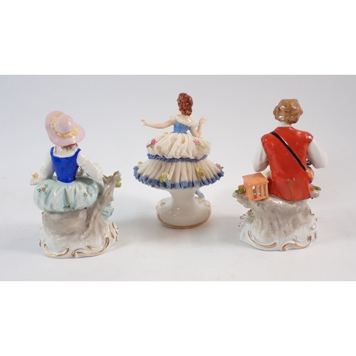 134 - A pair of Sitzendorf figures 'Bird Catcher' and 'Flower Seller' together with a Dresden lace dancing... 