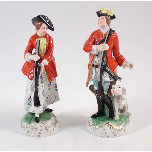 137 - A pair of Dresden Hunter and Huntress figures, 15.5cm high