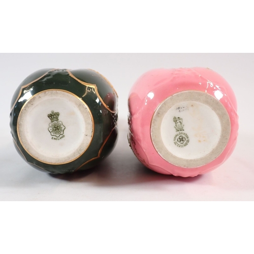138 - A Royal Doulton pair of vases painted landscapes on pink and green grounds, signed C Hart and W Brow... 