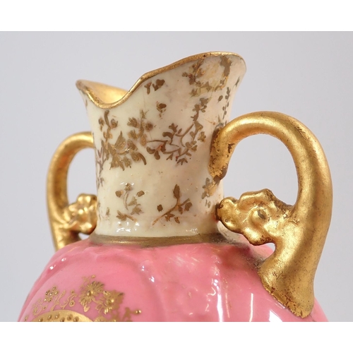 138 - A Royal Doulton pair of vases painted landscapes on pink and green grounds, signed C Hart and W Brow... 