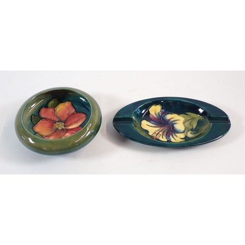 140 - A Moorcroft ashtray painted yellow hibiscus with paper Queen Mary label, 15.5cm wide plus a Moorcrof... 