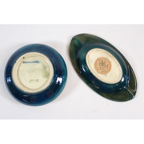 140 - A Moorcroft ashtray painted yellow hibiscus with paper Queen Mary label, 15.5cm wide plus a Moorcrof... 
