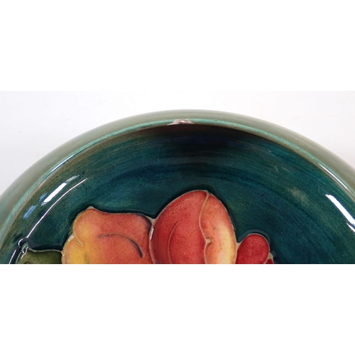 140 - A Moorcroft ashtray painted yellow hibiscus with paper Queen Mary label, 15.5cm wide plus a Moorcrof... 