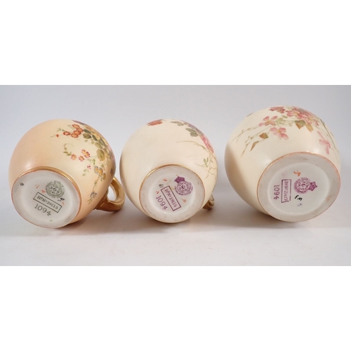 145 - Three Royal Worcester ivory blush jugs painted flowers No. 1094, tallest 13.5cm, one repaired