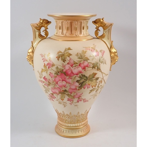 146 - A large Royal Worcester ivory blush vase painted 'Loves Lies Bleeding' with griffin and mask handles... 