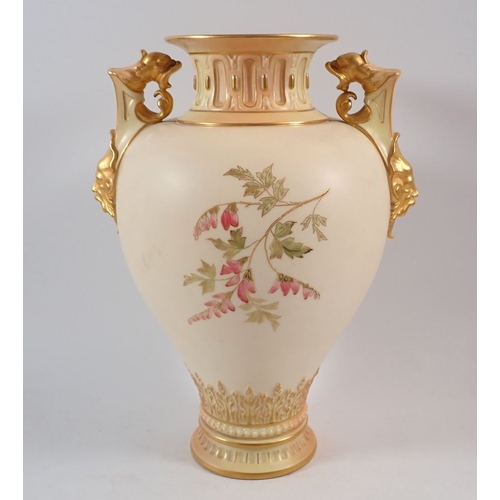146 - A large Royal Worcester ivory blush vase painted 'Loves Lies Bleeding' with griffin and mask handles... 