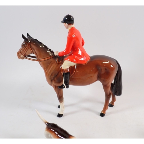 148 - A Beswick huntsman on horse, four hounds and a fox plus a character fox, 9cm tall