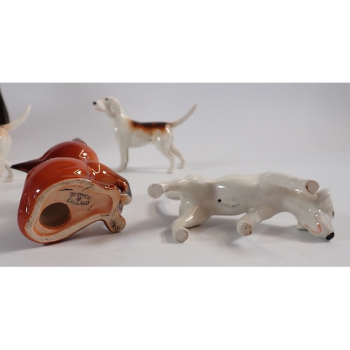 148 - A Beswick huntsman on horse, four hounds and a fox plus a character fox, 9cm tall