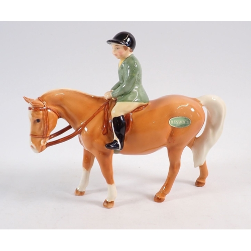 152 - A Beswick boy on a Palomino pony 13.5cm tall