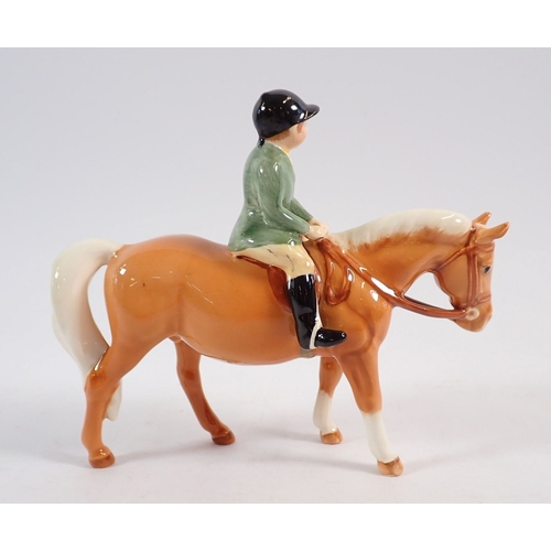 152 - A Beswick boy on a Palomino pony 13.5cm tall