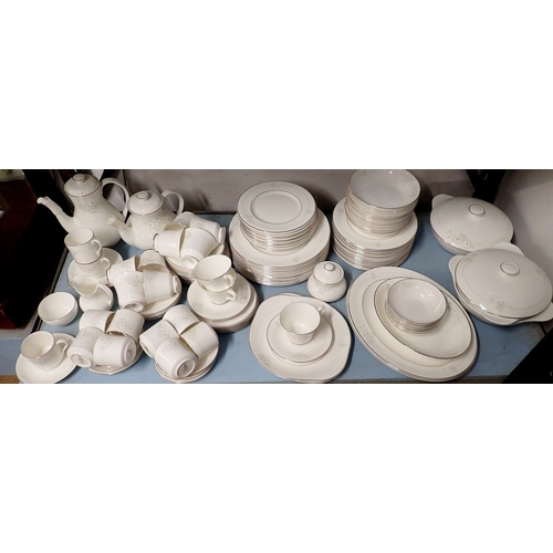 153 - A Royal Doulton comprehensive Mystique dinner service comprising eleven tea cups and twelve saucers,... 