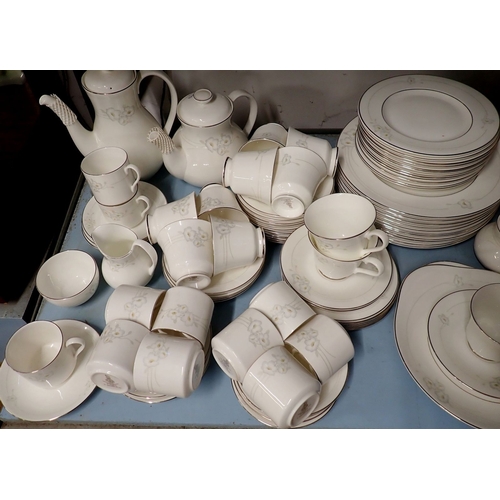 153 - A Royal Doulton comprehensive Mystique dinner service comprising eleven tea cups and twelve saucers,... 