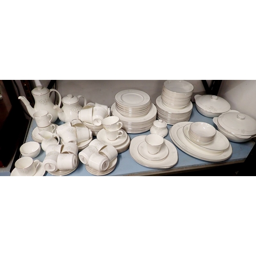 153 - A Royal Doulton comprehensive Mystique dinner service comprising eleven tea cups and twelve saucers,... 