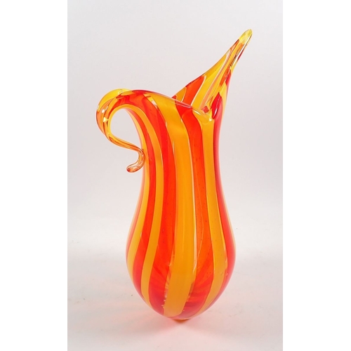 158 - A Murano style hand blown glass candy cane style jug in orange and yellow, 34.5cm tall