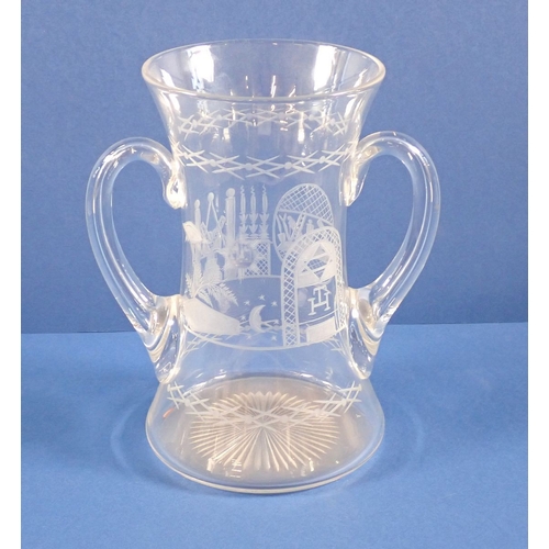 162 - A Victorian Masonic engraved glass with two handles, 18cm tall
