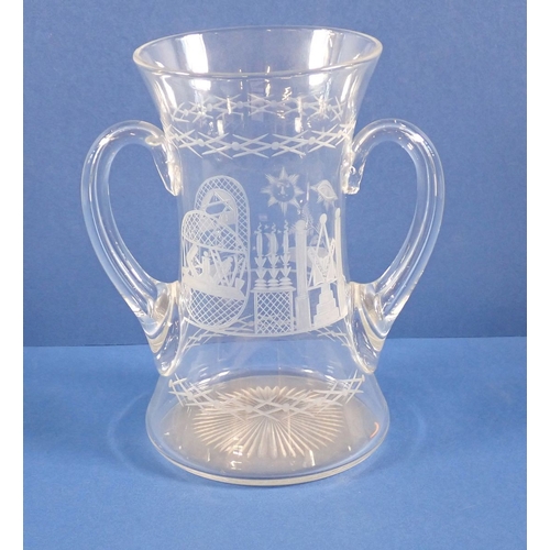 162 - A Victorian Masonic engraved glass with two handles, 18cm tall