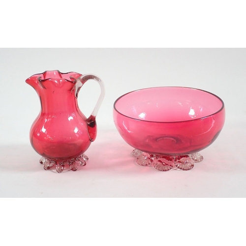 166 - A Victorian cranberry glass frill top jug and bowl, jug 10cm tall