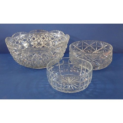 174 - A large moulded glass bowl, 35cm diameter and two cut glass bowls