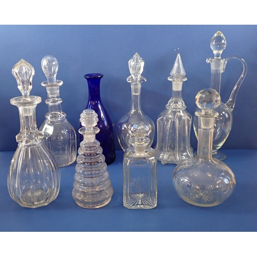 175 - A collection of decanters including antique cut glass examples, claret jug and a Bristol blue decant... 
