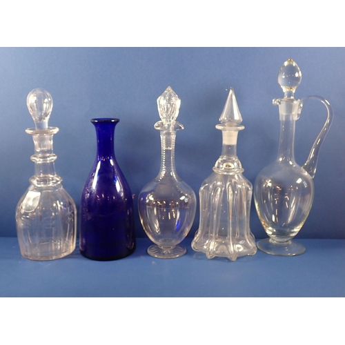 175 - A collection of decanters including antique cut glass examples, claret jug and a Bristol blue decant... 