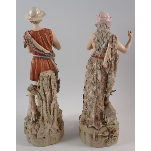18 - A Royal Dux pair of figures of Shepherd and Shepherdess with sheep and goats, both a/f, 38cm high