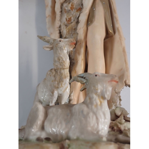 18 - A Royal Dux pair of figures of Shepherd and Shepherdess with sheep and goats, both a/f, 38cm high