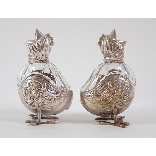 183 - Two glass and white metal chick form cruets, 7.5cm, one a/f