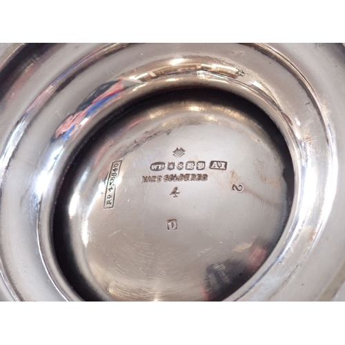 185 - An Art Nouveau silver plated four piece tea service with floral embossed decoration with tea straine... 