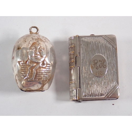 191 - A novetly silver plated book vesta case, sword letter opener, humpty dumpty rattle, marrow scoop and... 