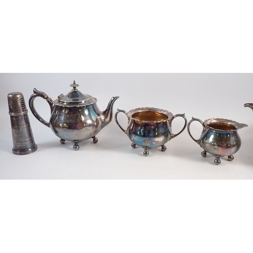 198 - A group of silver plated items including large shell form dish 33cm long, three piece tea set etc.