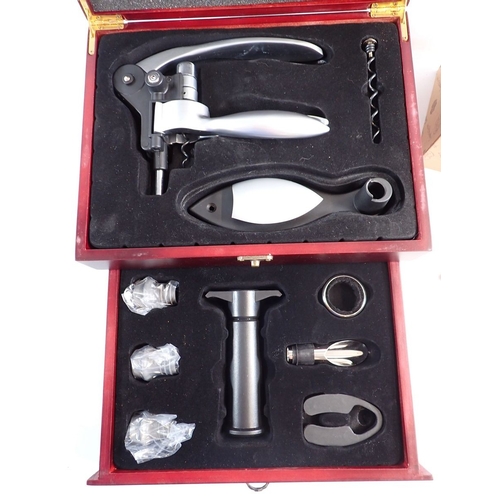 199 - A silver plated cocktail set, a corkscrew and wine funnel - all boxed, as new
