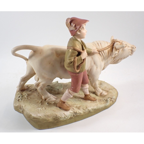 20 - A Royal Dux group of boy with bullock, 39cm wide
