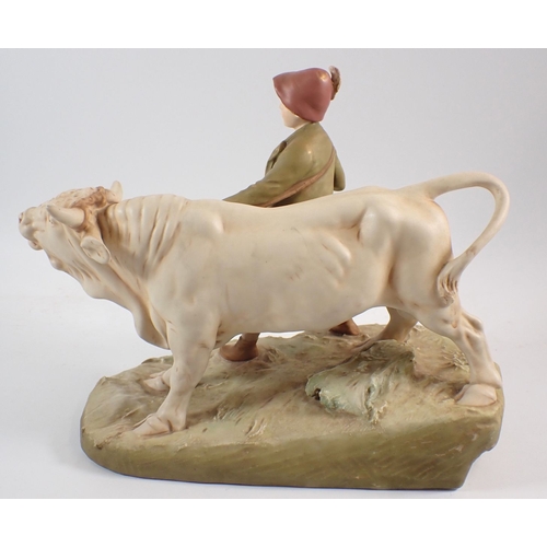 20 - A Royal Dux group of boy with bullock, 39cm wide