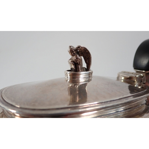 206 - An Omar Ramsden silver three piece Arts & Crafts tea service comprising teapot with kneeling angel f... 