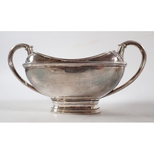206 - An Omar Ramsden silver three piece Arts & Crafts tea service comprising teapot with kneeling angel f... 