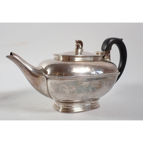 206 - An Omar Ramsden silver three piece Arts & Crafts tea service comprising teapot with kneeling angel f... 