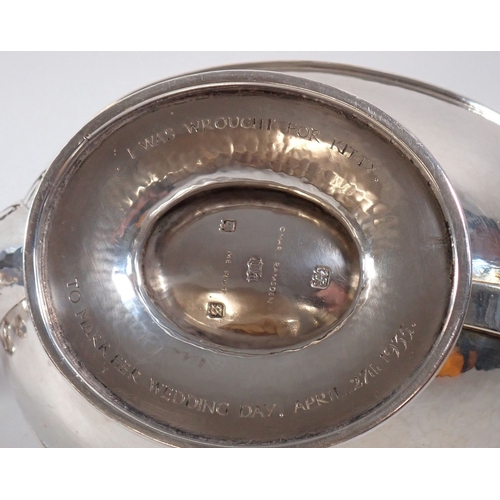 207 - An Omar Ramsden Arts & Crafts silver three piece tea service of naturalistic oval form on pedestal f... 