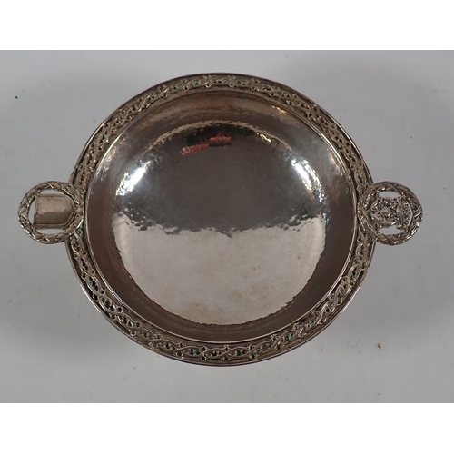 209 - An Omar Ramsden silver hammered Arts & Crafts pedestal dish with circular wreath handles inset shiel... 