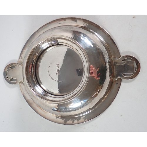 209 - An Omar Ramsden silver hammered Arts & Crafts pedestal dish with circular wreath handles inset shiel... 