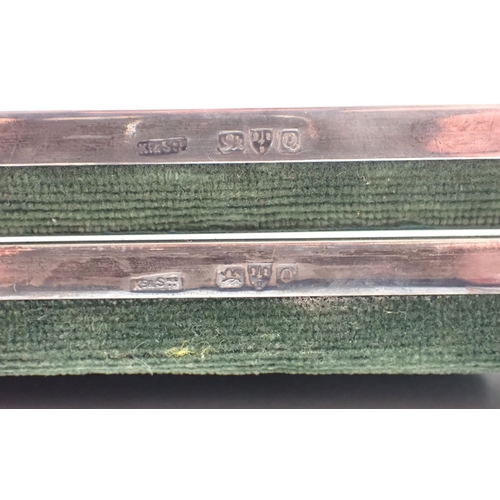 211 - A pair of silver photograph frames with scroll details, 23cm high, one with no back