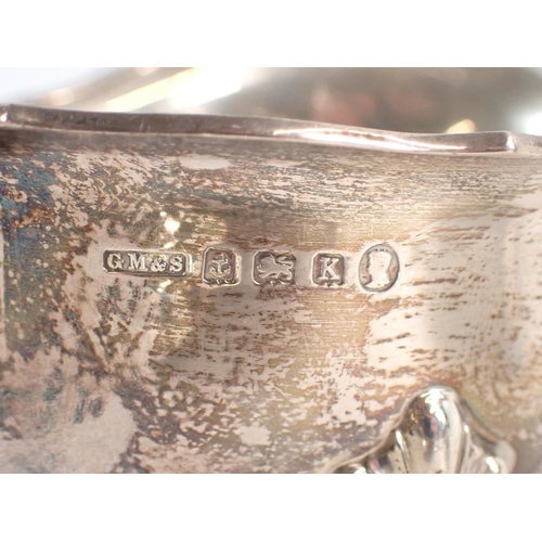 212 - Two silver sauce boats by William Neale, Birmingham 1913 and GM & S Birmingham 1934, with ladle, 234... 